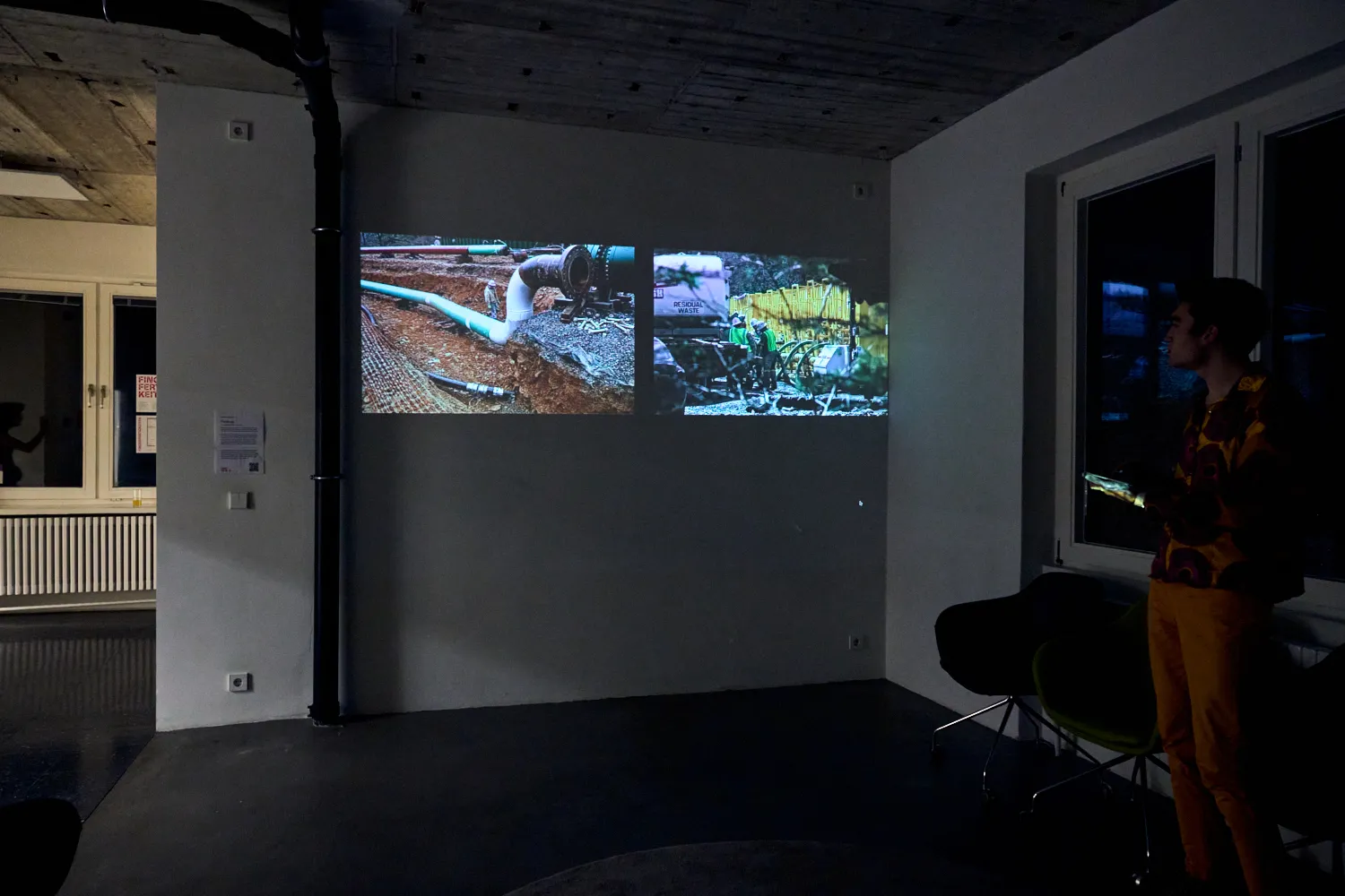 Wide shot with fracking infrastructure photos projected
